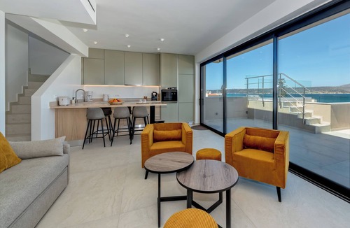 Kalyves Apartment | Villa Azurios - 2 Minute walk to the beach, with parking & lift access.