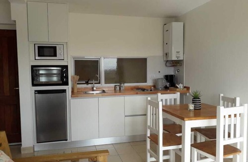 Macrozona Bahia Redonda y Primeros Faldeos Apartment | Warm and modern apartment with lake view