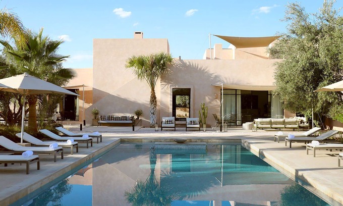 Annakhil Villa | My Rental Homes | Villa Eleganza pool, garden and house staff