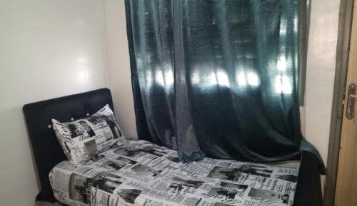 Single Bed in Dormitory Room