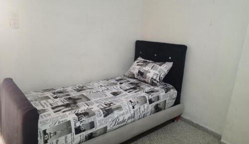 Single Bed in Dormitory Room