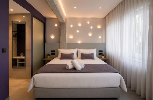Koukaki Villa | Gold & Concrete Acropolis Residence